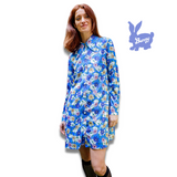 1960's style shirt dress. Mary Quant inspired bright blue dress with multi-color floral print. Print by Dave Hill.