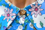 1960's style shirt dress. Mary Quant inspired bright blue dress with multi-color floral print. Print by Dave Hill.