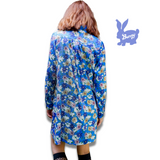 1960's style shirt dress. Mary Quant inspired bright blue dress with multi-color floral print. Print by Dave Hill.